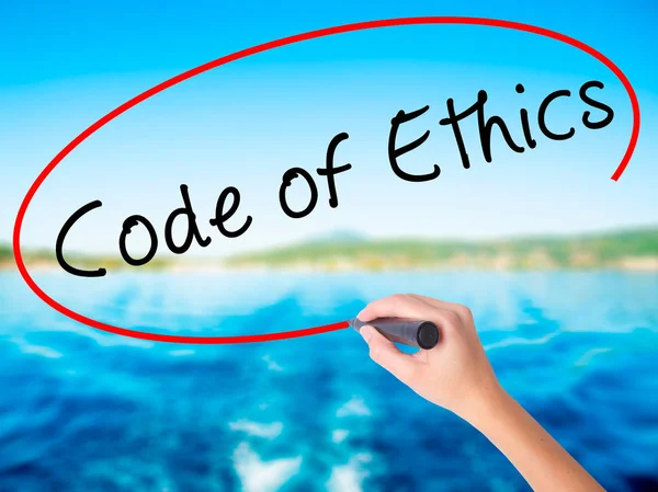 Woman Hand Writing Code of Ethics with a marker over transparent — Stock Photo, Image