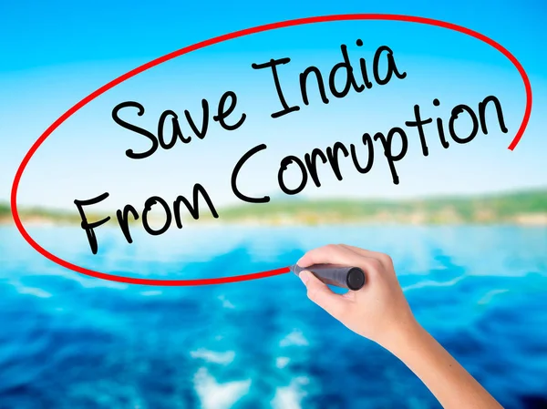 Woman Hand Writing Save India From Corruption with a marker over