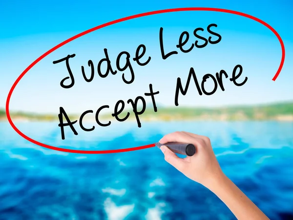 Woman Hand Writing Judge Less Accept More with a marker over tra — Stock Photo, Image