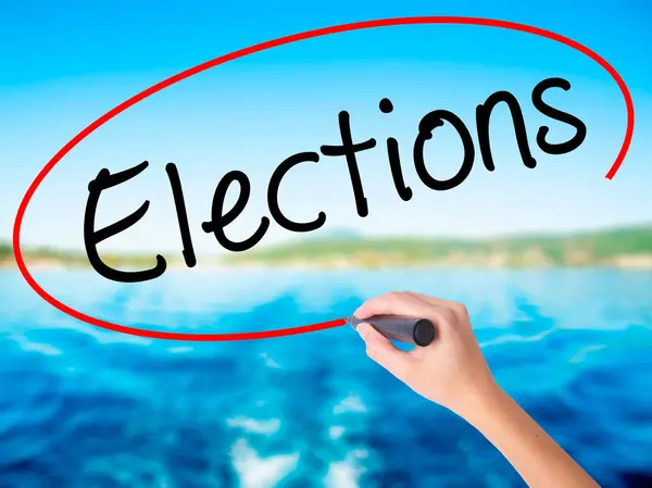 Woman Hand Writing Elections with a marker over transparent boar — Stock Photo, Image