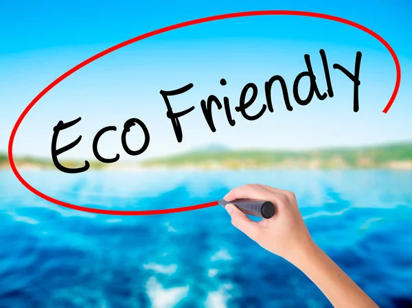 Woman Hand Writing Eco Friendly with a marker over transparent b — Stock Photo, Image