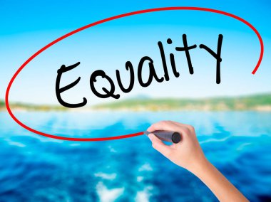 Woman Hand Writing Equality  with a marker over transparent boar clipart