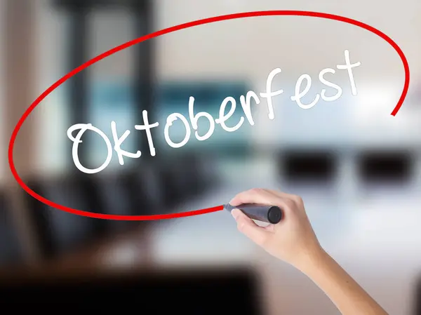 Woman Hand Writing Oktoberfest with a marker over transparent bo — Stock Photo, Image