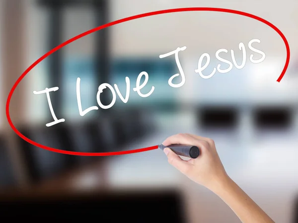 Γυναίκα χέρι γράφοντας Αγάπης Ιησού με μαρκαδόρο πάνω από διαφανή β — Φωτογραφία Αρχείου