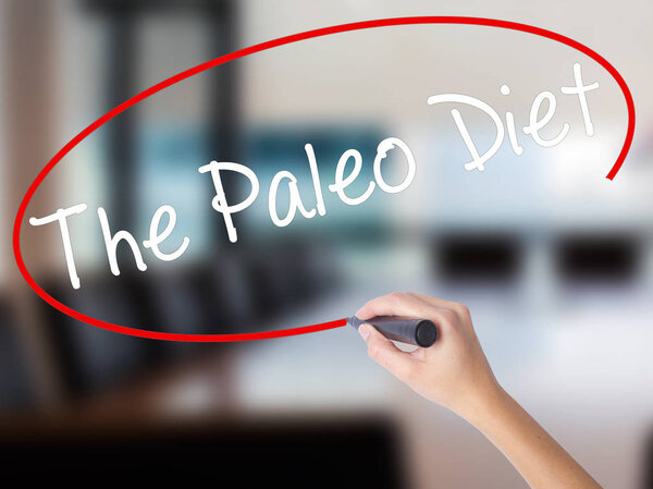 Woman Hand Writing The Paleo Diet with a marker over transparent