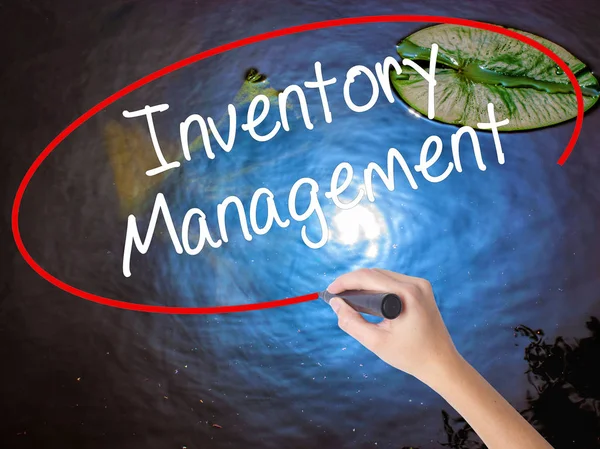 Woman Hand Writing Inventory Management with marker over transpa — Stock Photo, Image