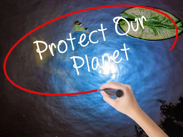 Woman Hand Writing Protect Our Planet with marker over transpare — Stock Photo, Image