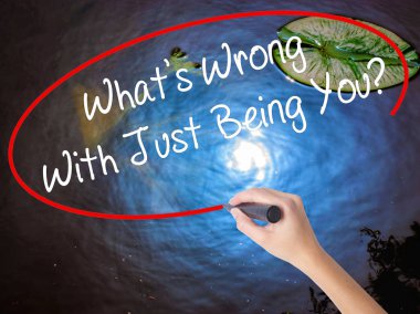 Woman Hand Writing What's Wrong With Just Being You? with marker clipart