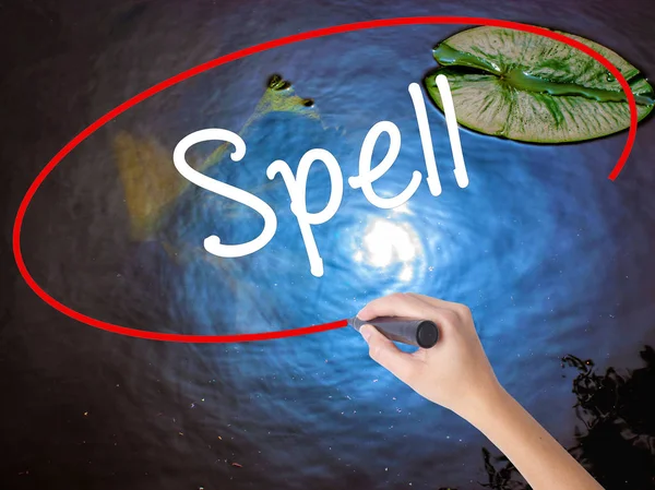 Woman Hand Writing Spell with marker over transparent board — Stock Photo, Image
