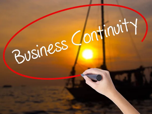 Woman Hand Writing Business Continuity with a marker over transp — Stock Photo, Image