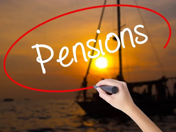Woman Hand Writing Pensions with a marker over transparent board — Stock Photo, Image