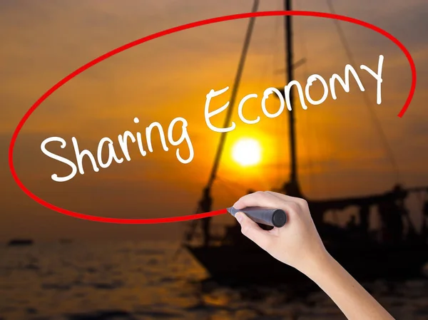 Woman Hand Writing Sharing Economy with a marker over transparen — Stock Photo, Image