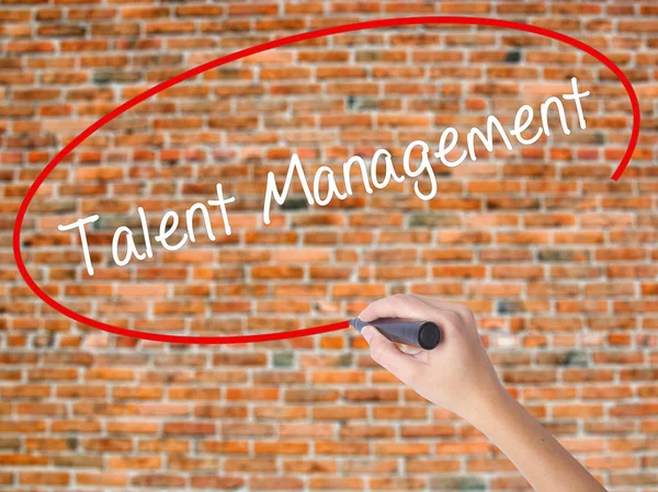 Woman Hand Writing Talent Management with black marker on visual