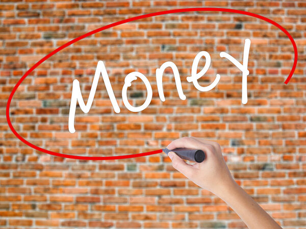Woman Hand Writing Money with black marker on visual screen