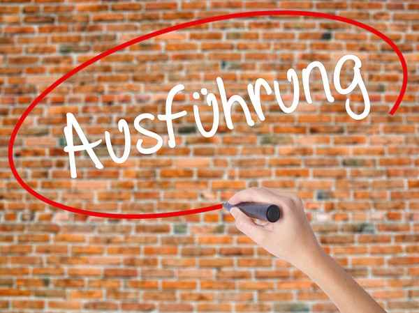 Woman Hand Writing Ausfuhrung (Execution in German) with black m — Stock Photo, Image