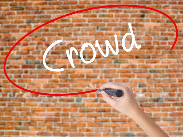 Woman Hand Writing Crowd with black marker on visual screen