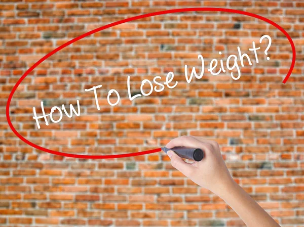 Woman Hand Writing How To Lose Weight? with black marker on visu — Stock Photo, Image
