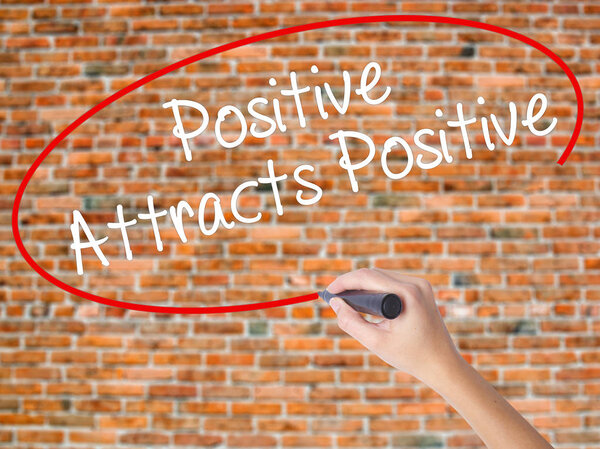 Woman Hand Writing Scope with a marker over transparent board 