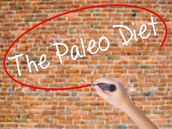 Woman Hand Writing Scope with a marker over transparent board 