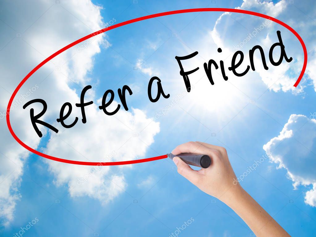 Woman Hand Writing Refer a Friend  with black marker on visual s