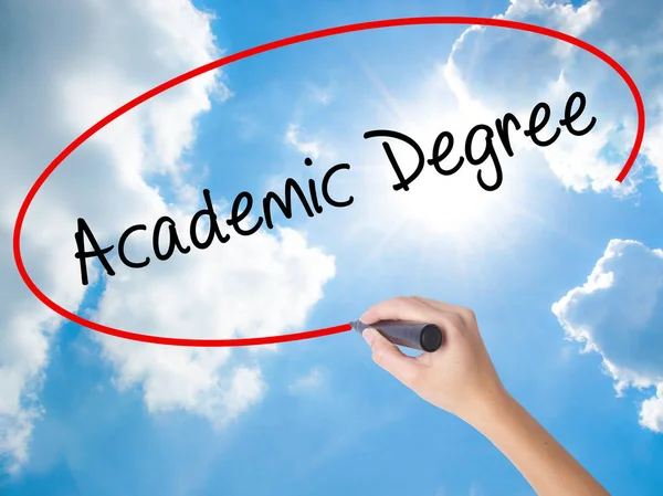 Woman Hand Writing Academic Degree with black marker on visual s