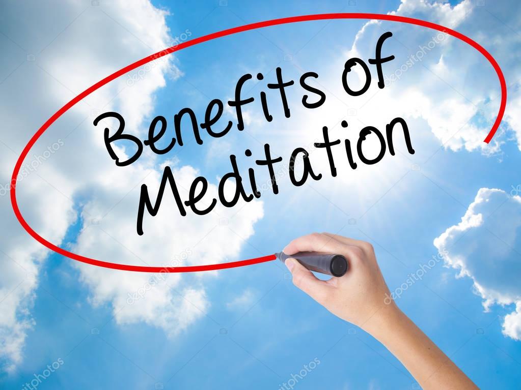 Woman Hand Writing Benefits of Meditation with black marker on v
