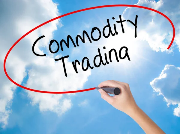 Woman Hand Writing Commodity Trading with black marker on visual — Stock Photo, Image