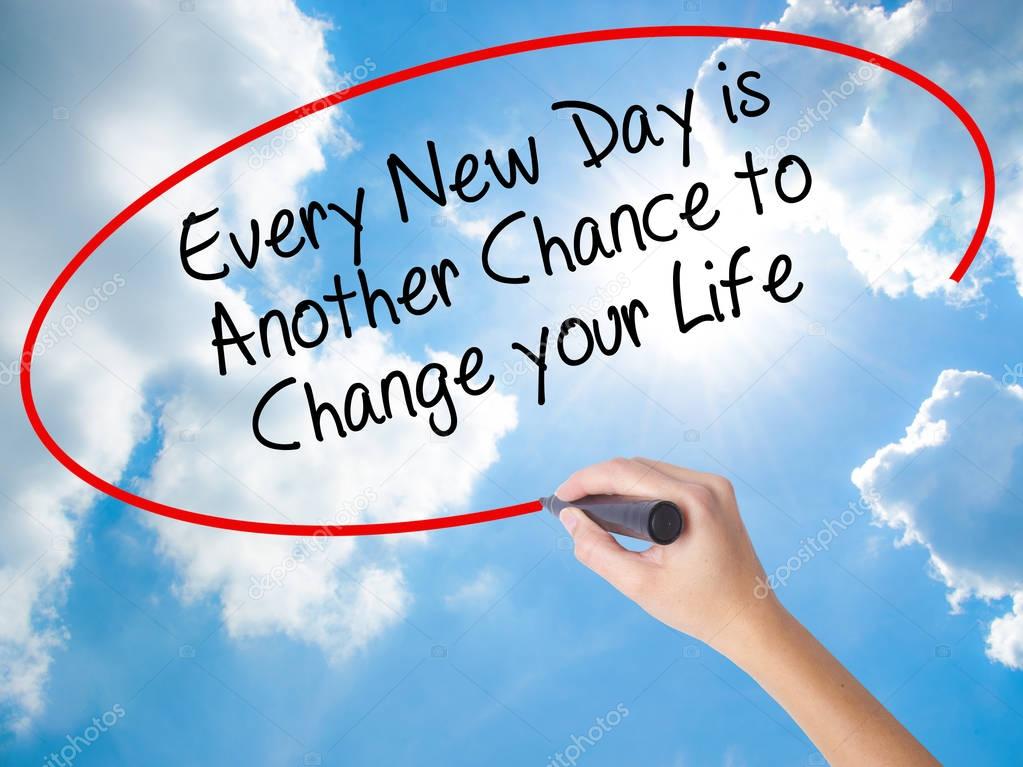 Woman Hand Writing Every New Day is Another Chance to Change you