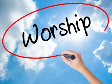 Woman Hand Writing Worship with black marker on visual screen clipart