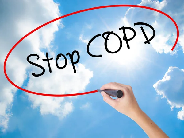 Woman Hand Writing Stop COPD with black marker on visual screen
