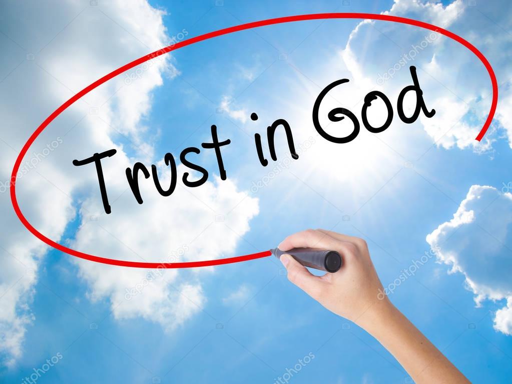 Woman Hand Writing Trust in God with black marker on visual scre