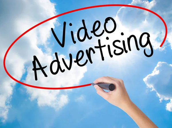 Woman Hand Writing Video Advertising with black marker on visual