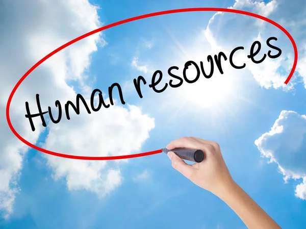 Woman Hand Writing Human resources with black marker on visual s
