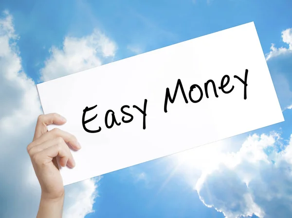 Easy Money Sign on white paper. Man Hand Holding Paper with text