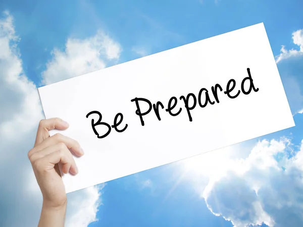 Be Prepared Sign on white paper. Man Hand Holding Paper with tex — Stock Photo, Image