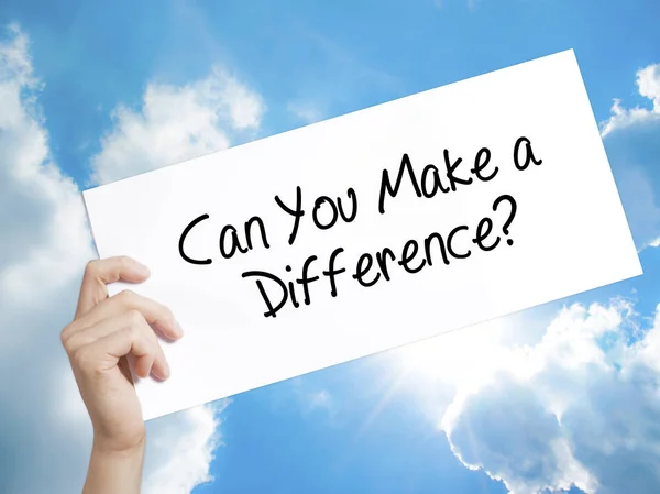 Can You Make a Difference? Sign on white paper. Man Hand Holding