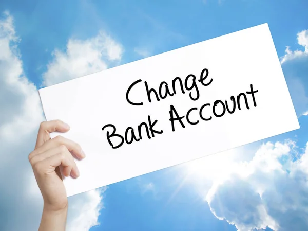 Change Bank Account Sign on white paper. Man Hand Holding Paper