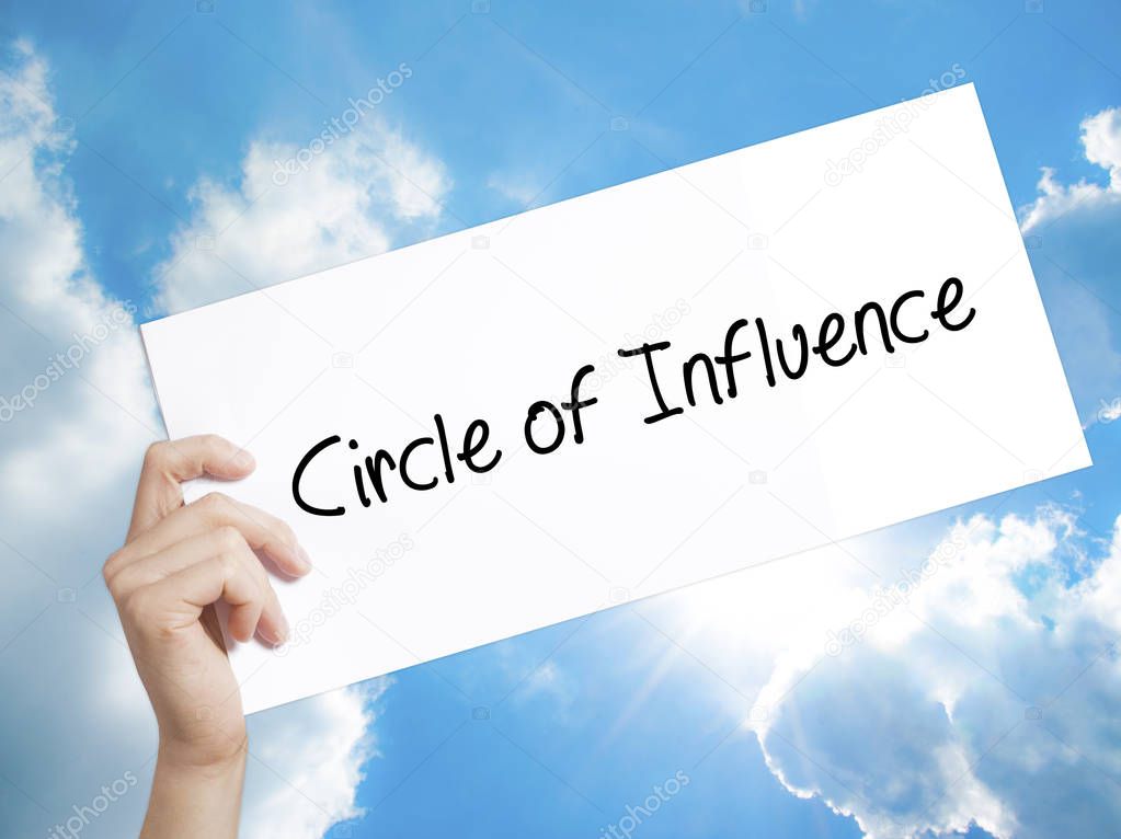 Circle of Influence Sign on white paper. Man Hand Holding Paper 