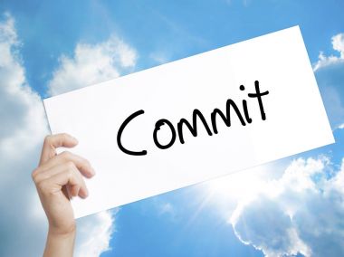 Commit Sign on white paper. Man Hand Holding Paper with text. Is clipart