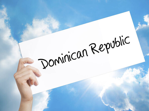 Dominican Republic Sign on white paper. Man Hand Holding Paper w