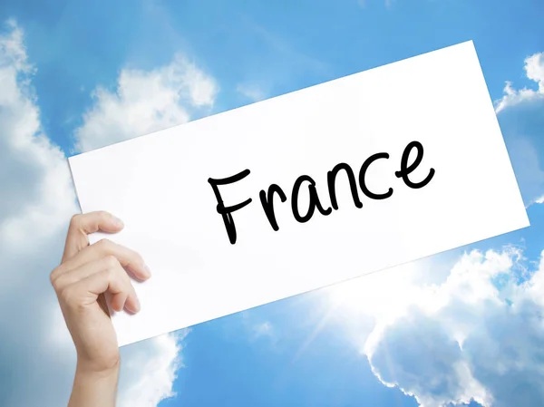 Γαλλία σημάδι στη Λευκή Βίβλο. Άνθρωπος χέρι κρατά χαρτί με το κείμενο. Είναι — Φωτογραφία Αρχείου