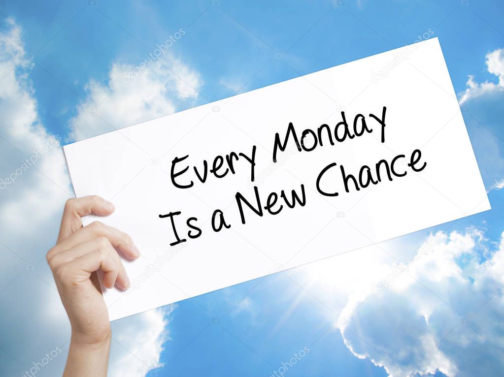 Every Monday Is a New Chance Sign on white paper. Man Hand Holdi