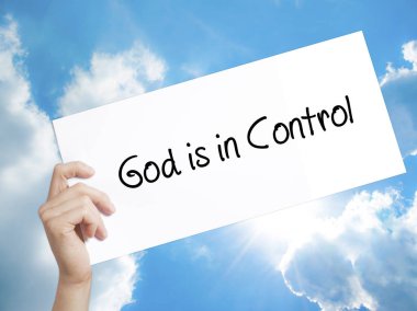 God is in Control Sign on white paper. Man Hand Holding Paper wi clipart