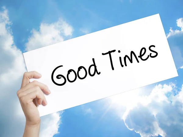 Good Times Sign on white paper. Man Hand Holding Paper with text