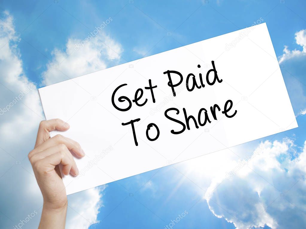 Get Paid To Share Sign on white paper. Man Hand Holding Paper wi