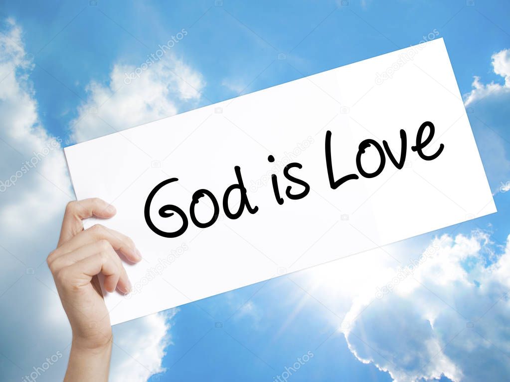 God is Love Sign on white paper. Man Hand Holding Paper with tex