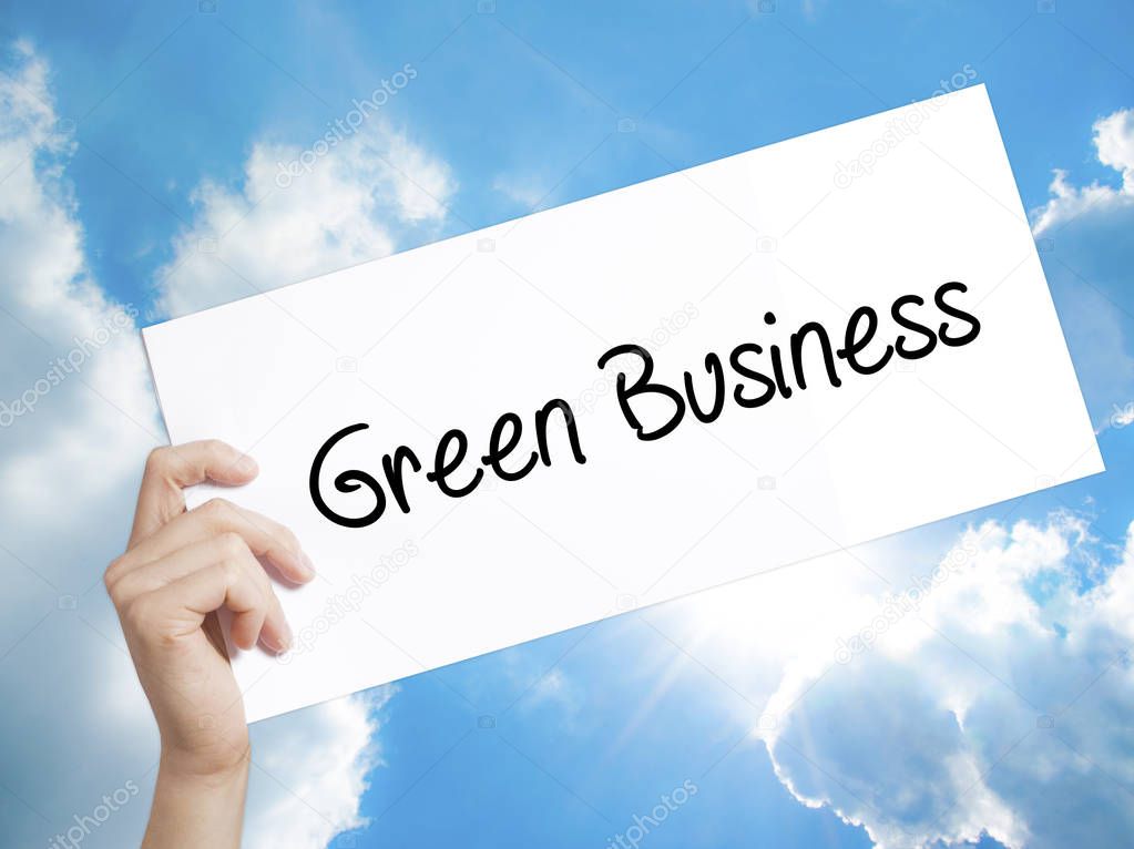 Green Business Sign on white paper. Man Hand Holding Paper with 