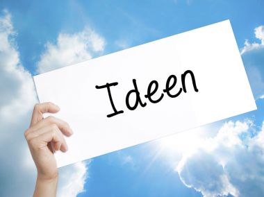Beyaz kağıt üzerine Ideen (Alman fikirleri) işareti. Adam el Holding P