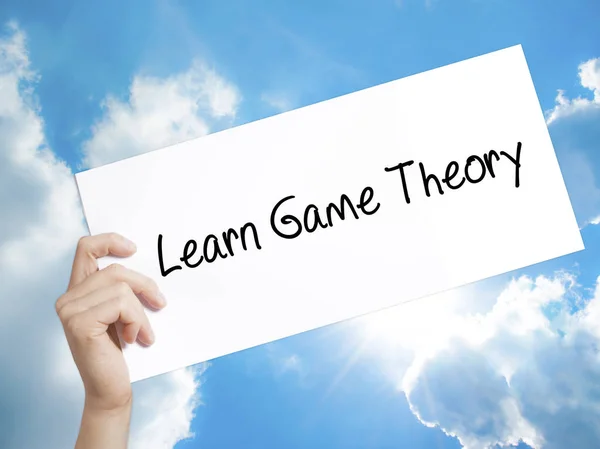 Learn Game Theory Sign on white paper. Man Hand Holding Paper wi