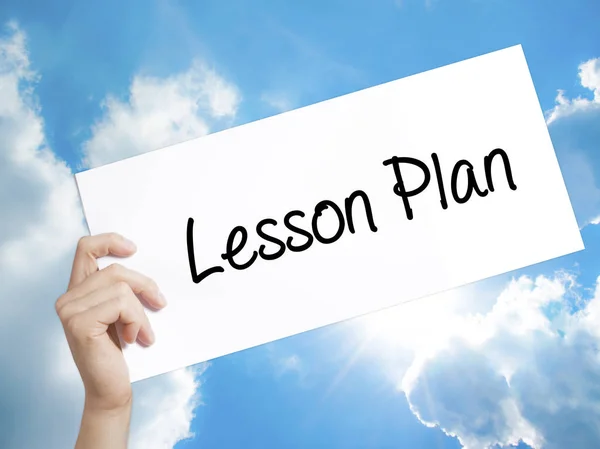 Lesson Plan Sign on white paper. Man Hand Holding Paper with tex